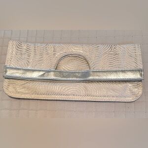 Amici silver and ivory fold over clutch with silver pattern fabric